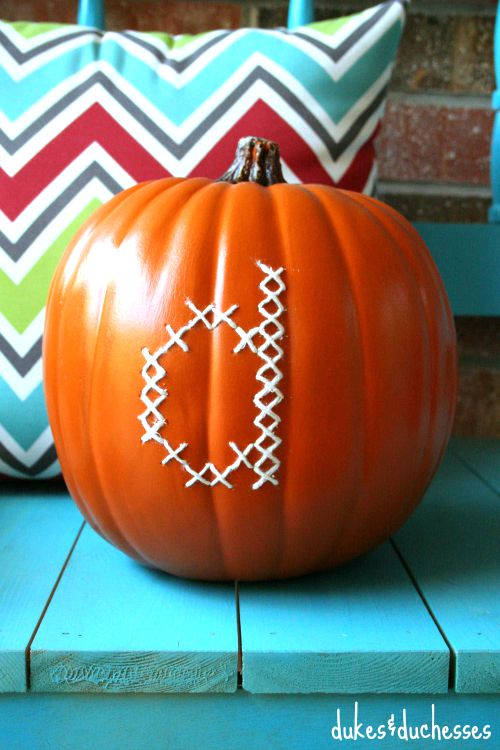 cross stitched monogram on a pumpkin