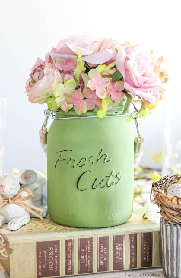 Create this Simple Easter Tablescape Decor using glass jars and chalky finish paint for glass. These beautiful neutral colors will brighten the home for spring.