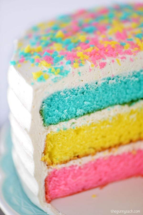 pink, yellow and blue sliced Easter cake