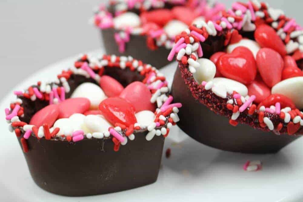 Valentine\'s Day chocolate heart balls with sprinkles and red and pink and white candy